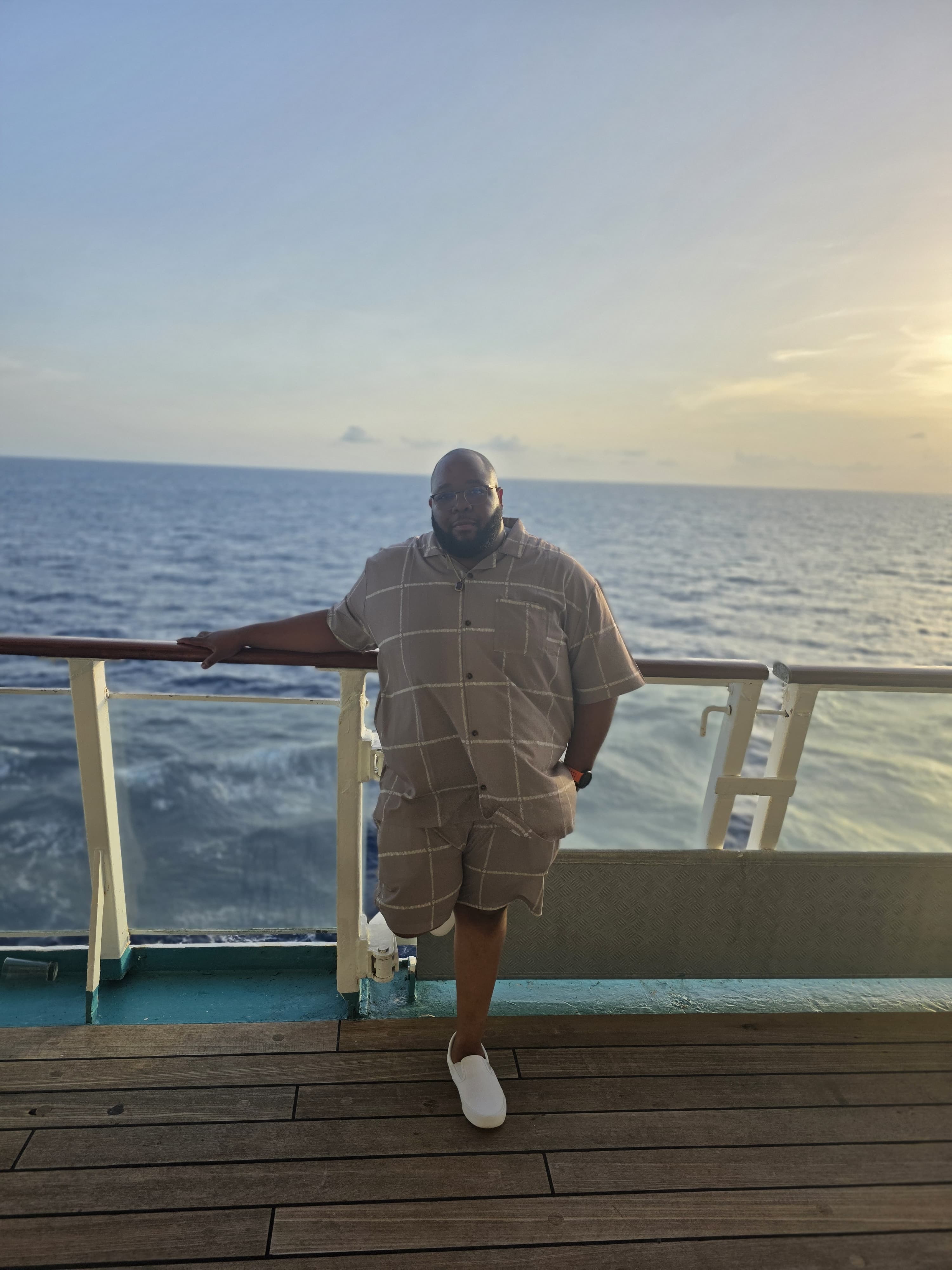 Howard D'Oyley II on a ship deck at sunset